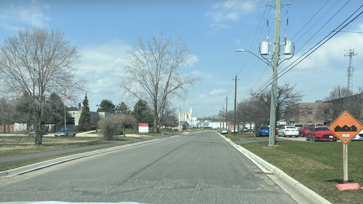 The rehabilitated road, curb, and sidewalk/