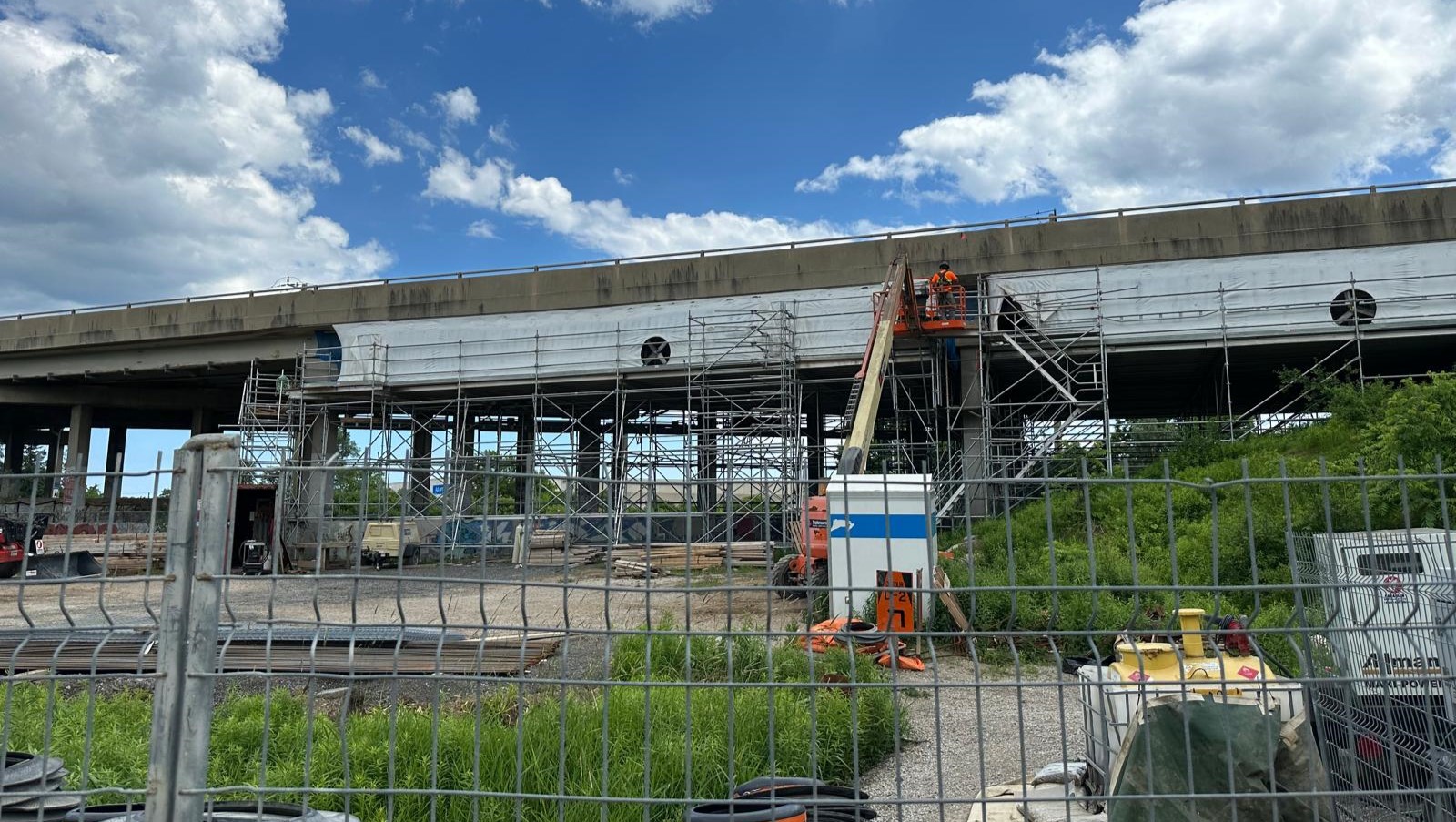 A wide shot of the bridge during construction.