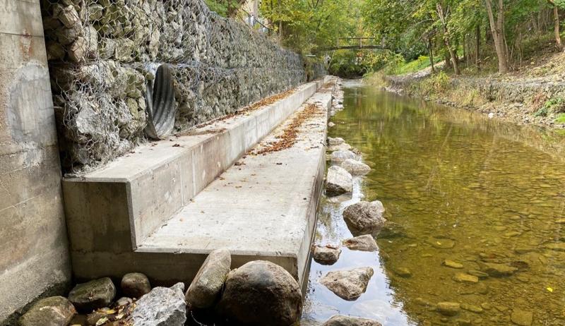 The rehabilitated culvert flowing into a stream. 