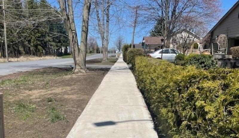 The newly rehabilitated sidewalk