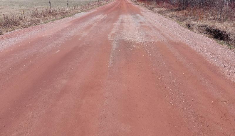 A dirt road which runs over the culvert