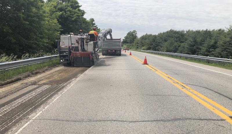 Workers prepare the shoulder of the road for the installation of cycling routes in the Town of Caledon.