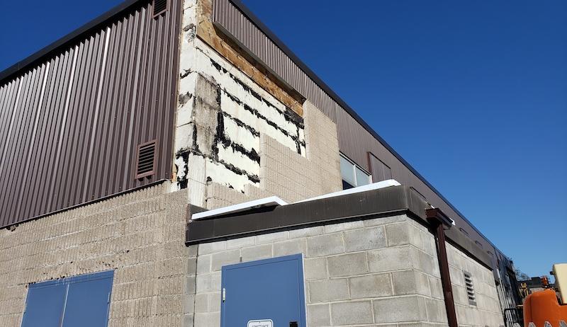 The outside of Perth's indoor pool building is shown with pieces missing. 