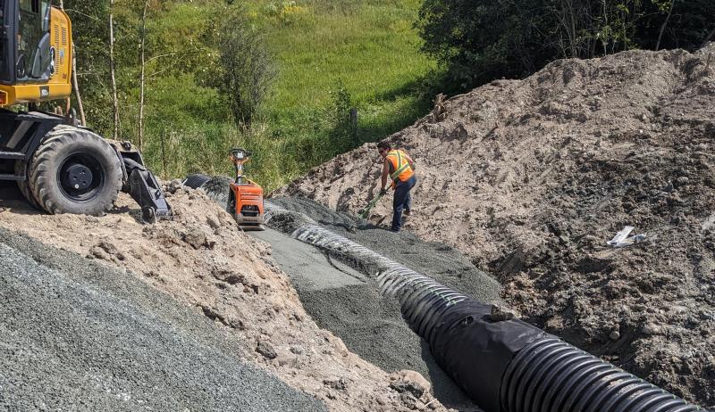 Workers replacing a culvert in Plummer Additional. 