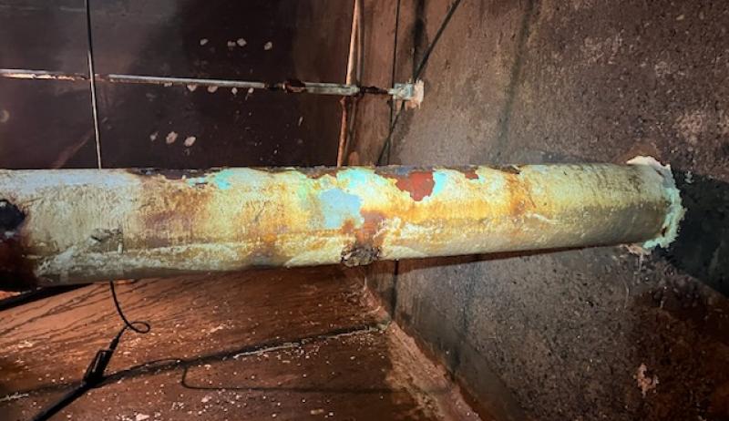 A worn pipe in a water treatment facility. 