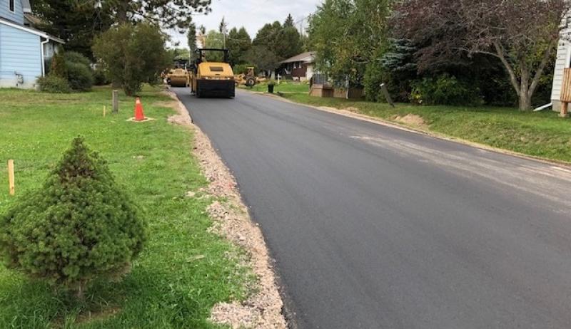 A picture showing a new road surface being constructed.